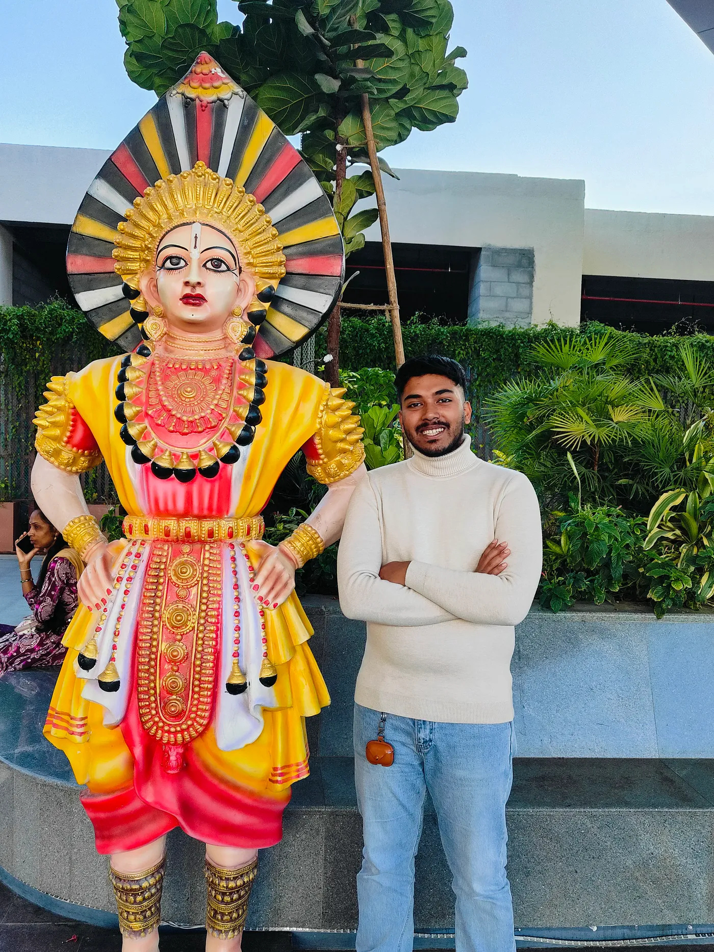 Posing with statue at Kempegowda Airport